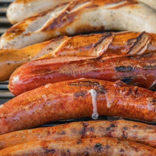 grilled sausages on a barbecue grill