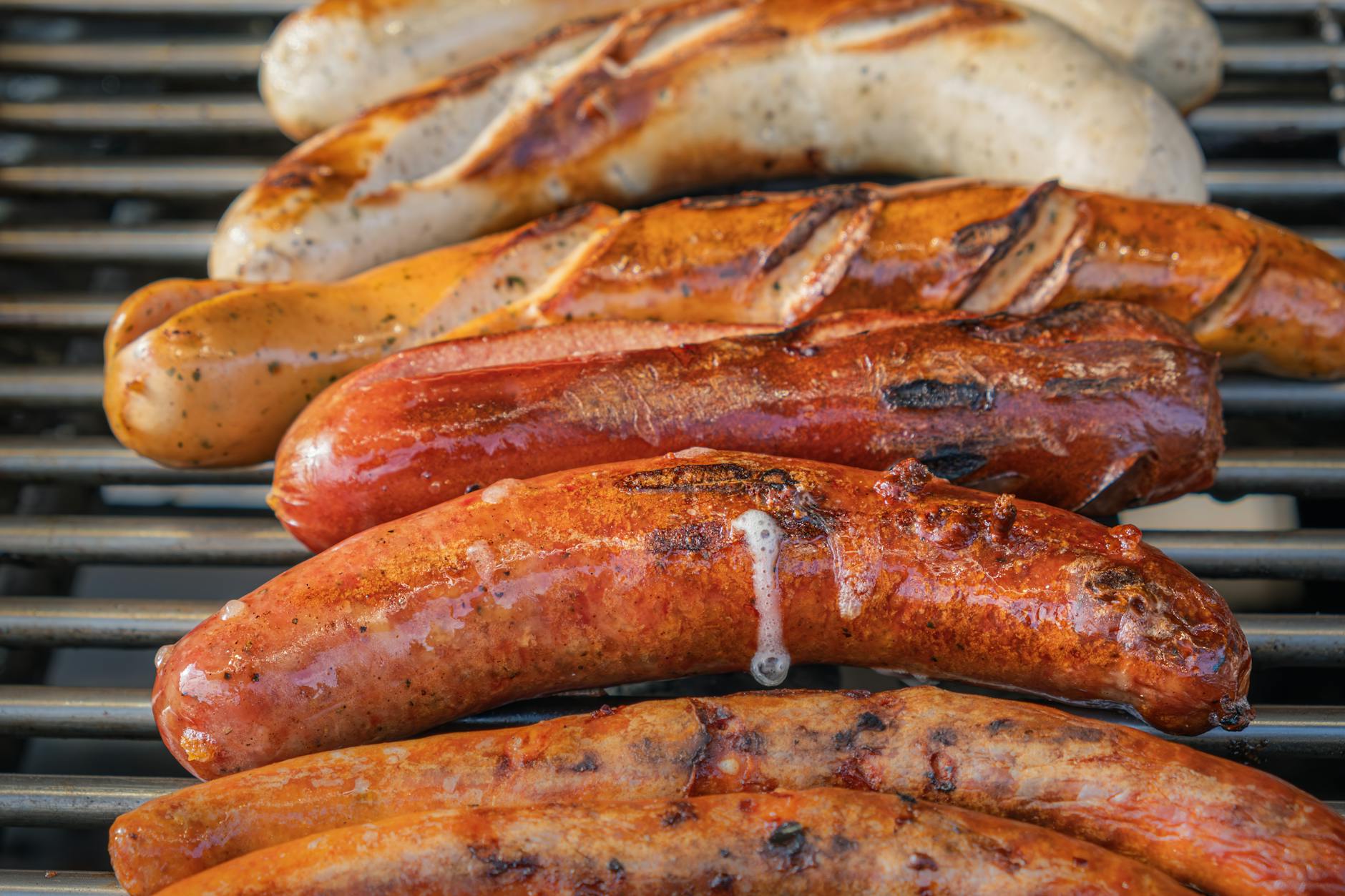 grilled sausages on a barbecue grill