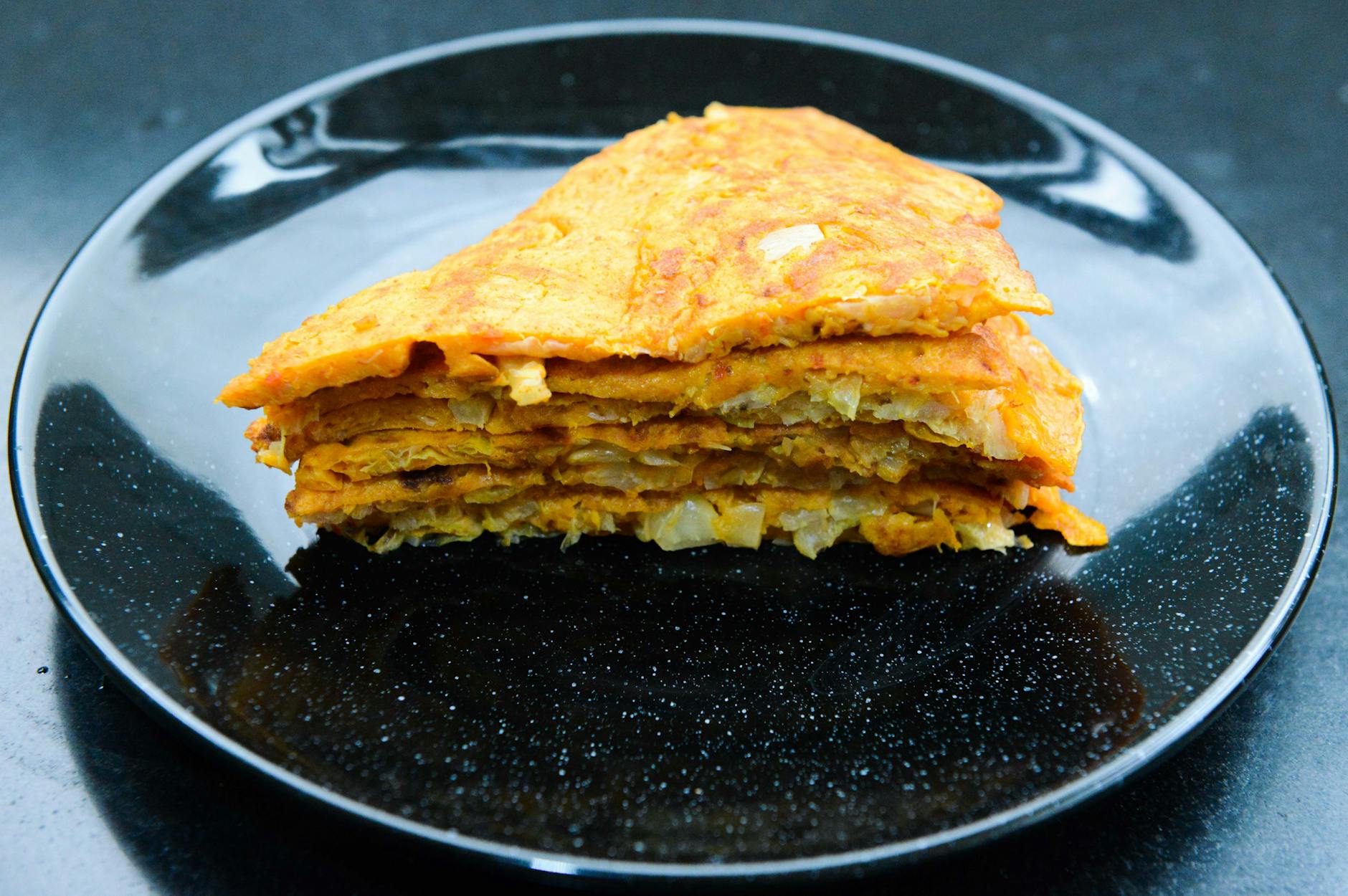 stack of pancakes on round black ceramic plate