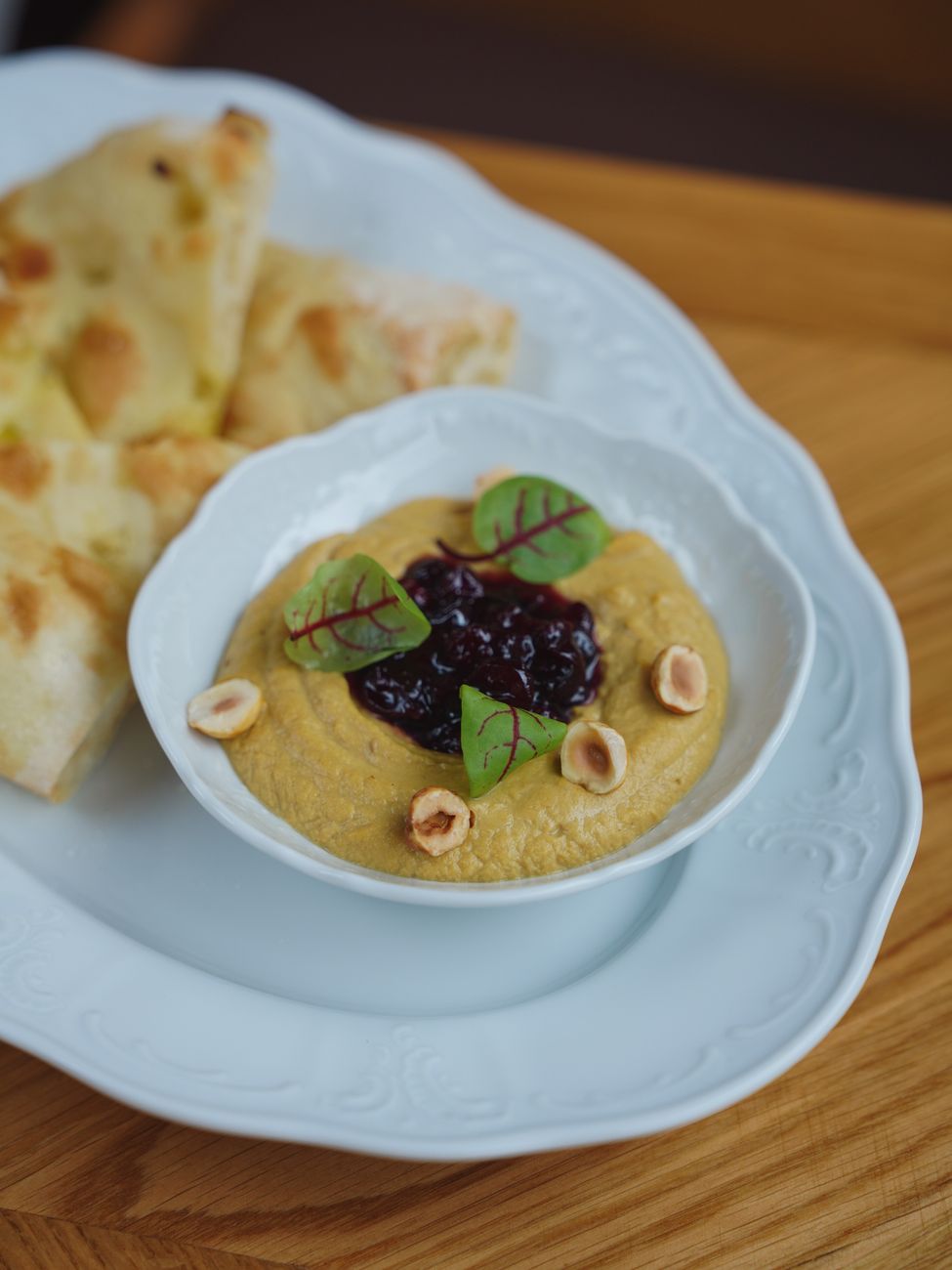 hummus served with jam and nuts