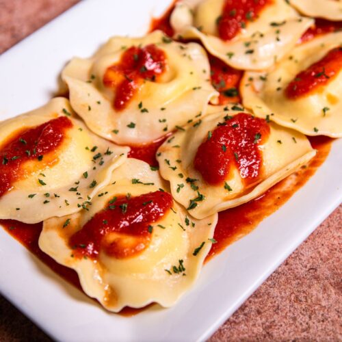 delicious italian ravioli with tomato sauce