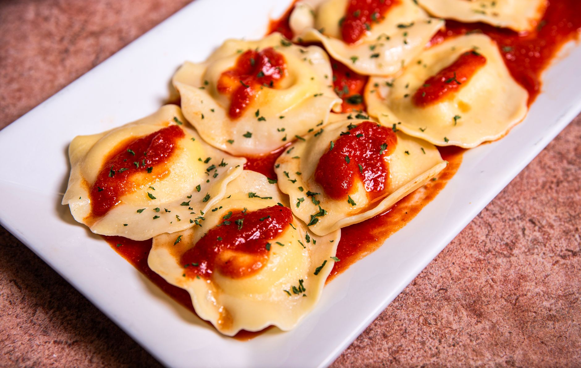 delicious italian ravioli with tomato sauce