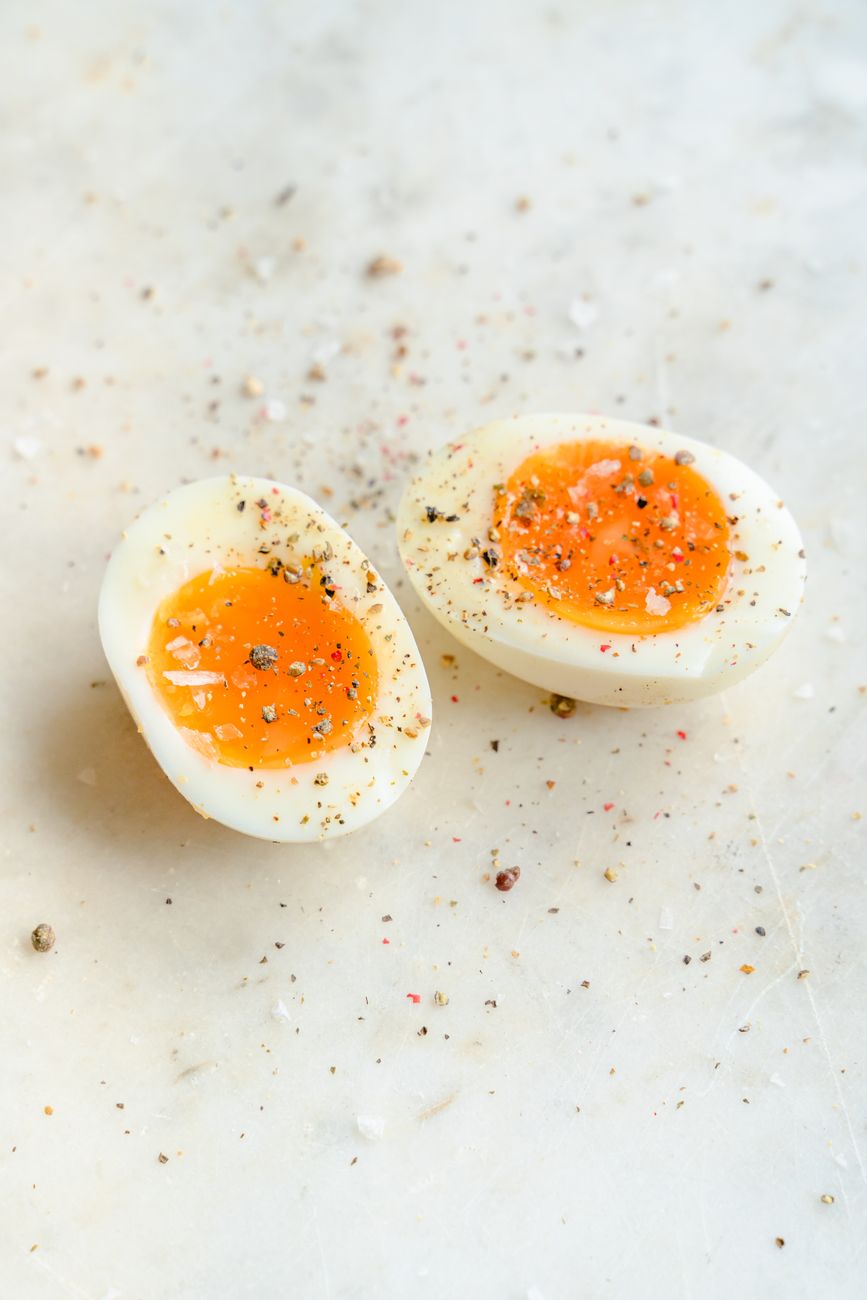 cut eggs on white background
