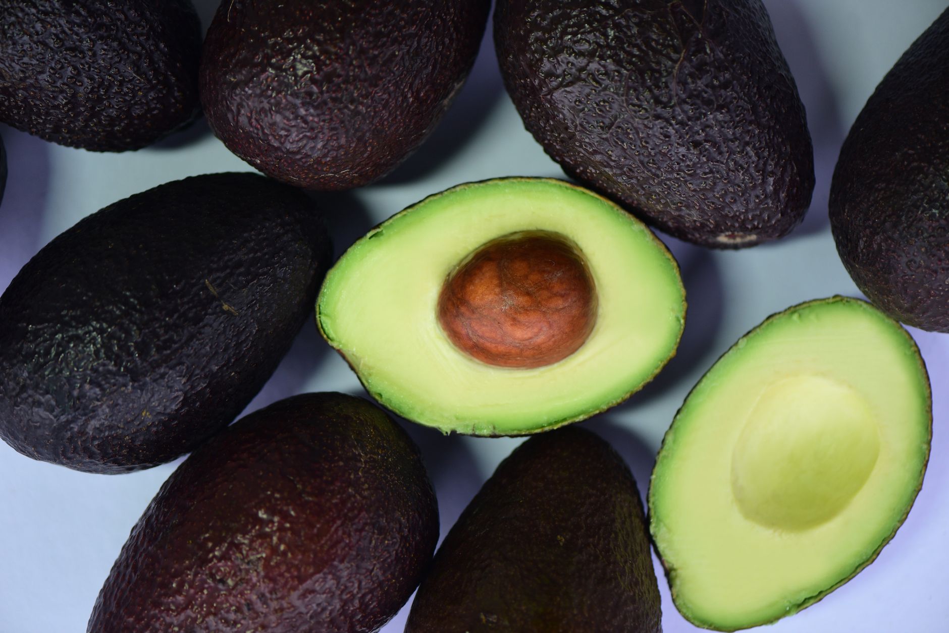 top view of avocados in white surface